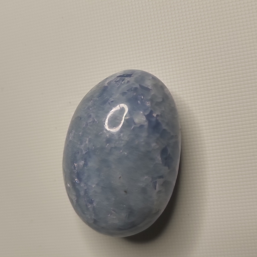 Blue calcite palm stone